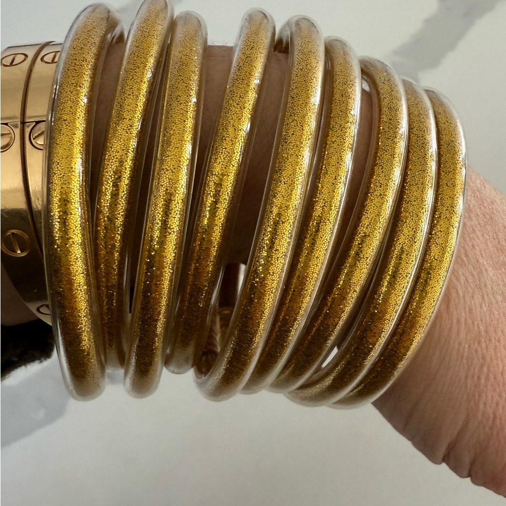 Designer Inspired yellow-Gold plastic bracelets, set of 9 bangles. NWOT 9.5”